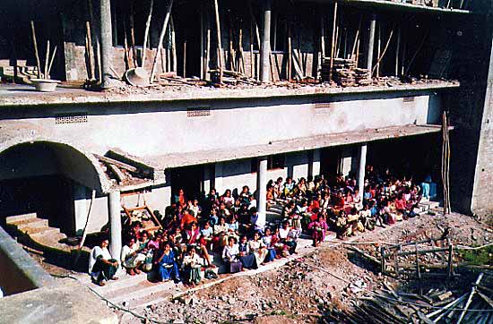 Girls outside the new dormitory building Girls outside the new dormitory building